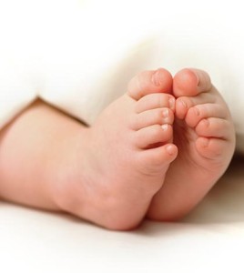 Uncovered baby boy's small feet