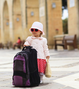 cute little lady travelling in the city of Europe